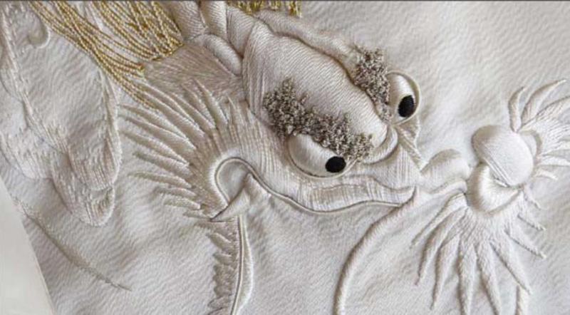 White dragon - silk artwork, image from the poster promoting “Silk Unraveled” exhibit.