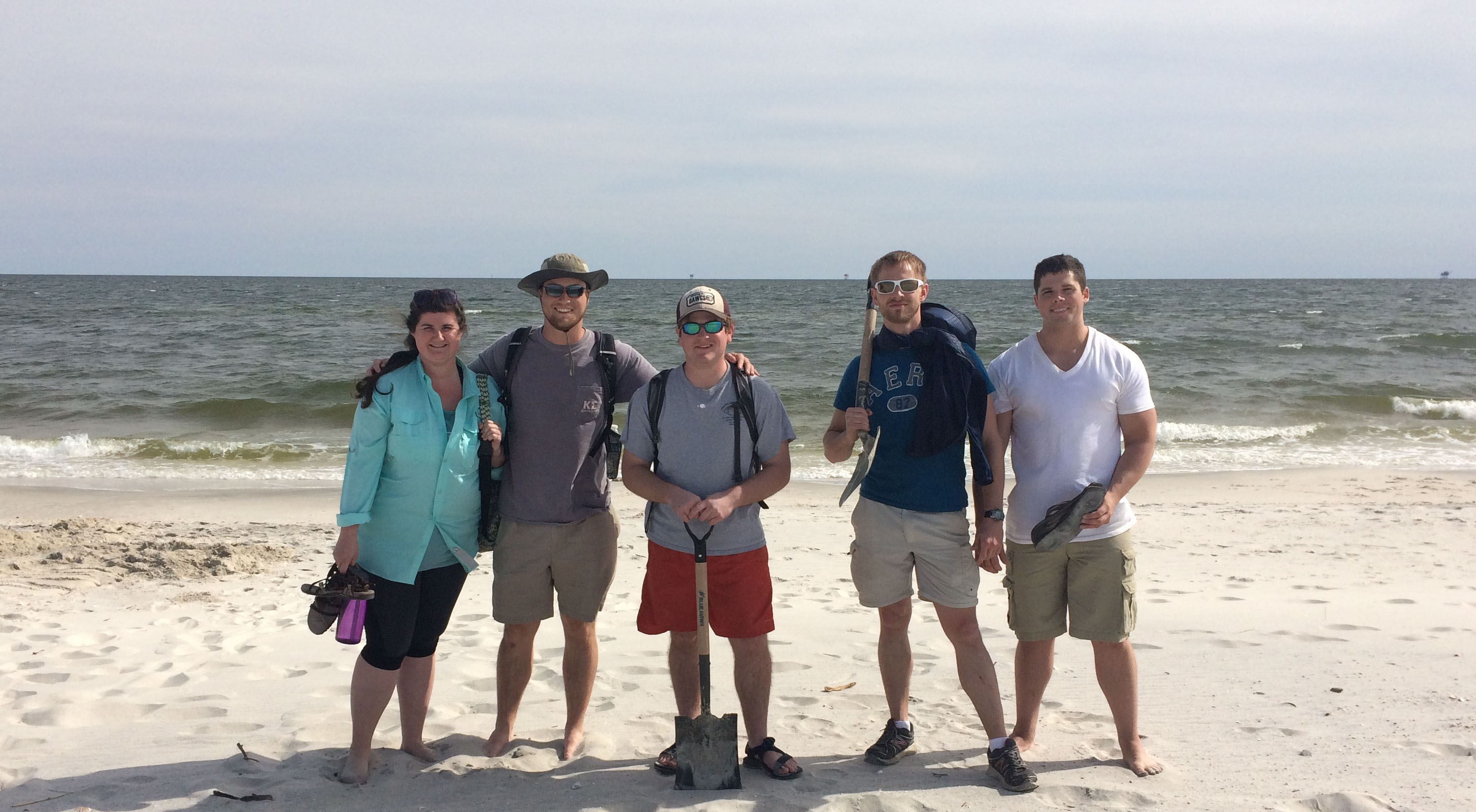 Students take a break after examining shore face deposits on Dauphin Island