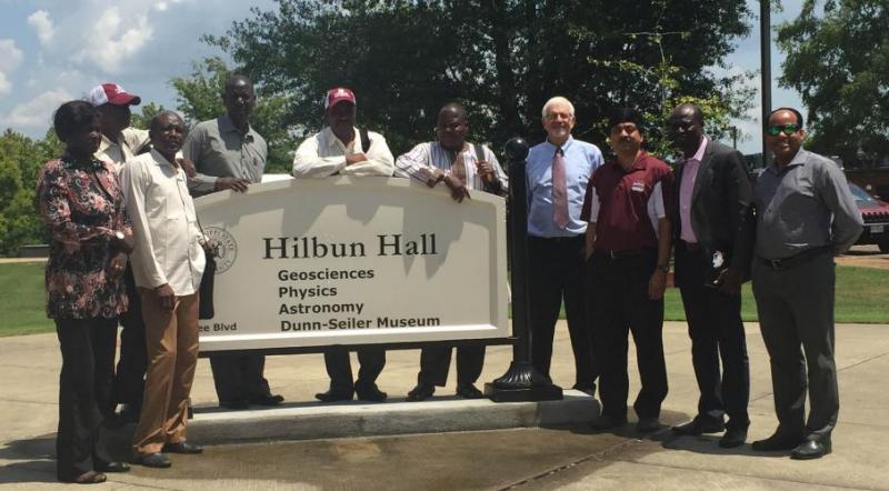 Padmanava Dash (first from right), Shrinidhi Ambinakudige (third from right), Bill Cooke (fourth from right), and the Cochran Fellows from Mali and Senegal in front of the Hilbun Hall. 
