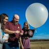 Meteorology faculty and students launching a weather balloon.
