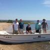 Students visit a marsh fronting a barrier island in the Grand Bay National Estuarine Research ReserveS
